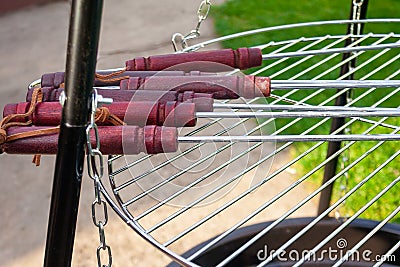 Grill tools on new chrome stell grate. Clean grate. Stock Photo