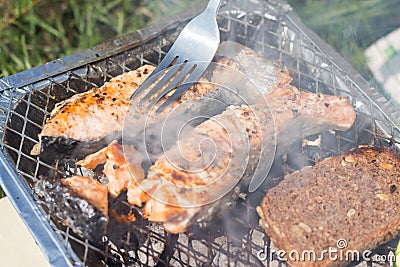 Grill with vegetables. Tomatoes, zucchini, chicken and cucumber. On the grid grill are fried vegetables. Stock Photo