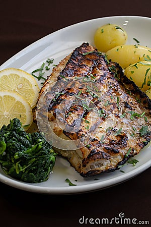 Grilled Bass with baked potatoes 