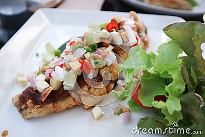 Grilled bass, grilled fish with spicy dressing Stock Photo