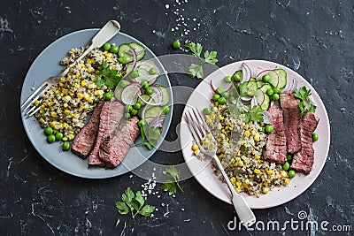 Grilled beef steak and quinoa corn mexican salad on dark background, top view. Delicious healthy balanced food Stock Photo