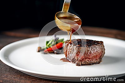 Grilled beef tenderloin steak on a white plate Stock Photo