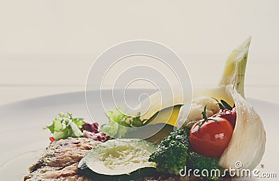 Grilled beefsteak with vegetables and green bell pepper sauce Stock Photo