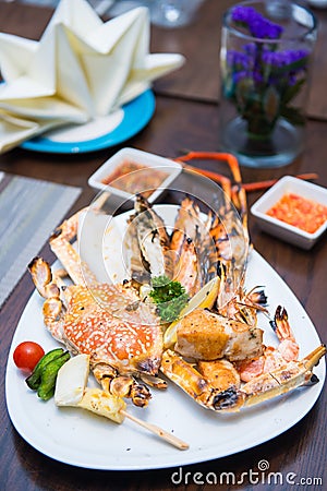 Grilled big crabs and seafood for dinner Stock Photo