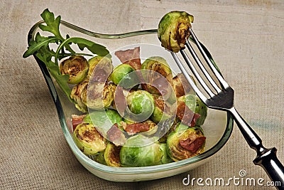 Grilled Brussels sprouts with bacon Stock Photo