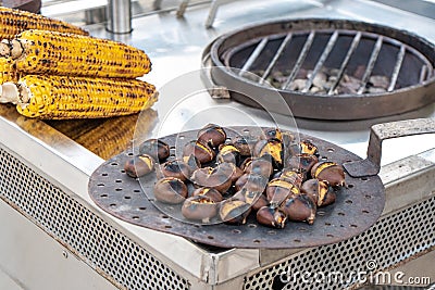 Grilled chestnut and corn on the street market in Athens Stock Photo