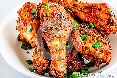 Grilled Chicken / Baked Chicken Legs Garnished with Scallion Stock Photo