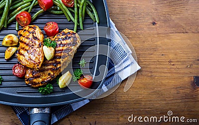 Grilled chicken breast in different variations with cherry tomat Stock Photo