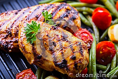 Grilled chicken breast in different variations with cherry tomat Stock Photo