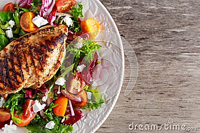 Grilled Chicken Breast fillet with fresh tomatoes vegetables salad. concept healthy food. Stock Photo