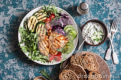 Grilled chicken breast, zucchini and garden vegetable power bowl. Healthy diet food concept Stock Photo