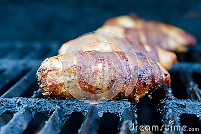 Grilled chicken rolled in bacon Stock Photo