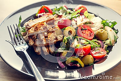 Grilled chicken salad and vegetables. Dietetic healthy food Stock Photo