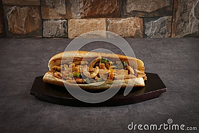 Grilled chicken sandwich with green piper and american cheese on a gray background Stock Photo