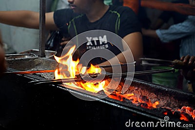 Grilled Chicken Seekh Kebab at Zakaria Street Near Nakhoda Masjid During Eid al-Fitr Editorial Stock Photo
