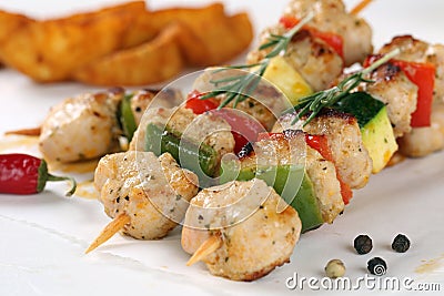 Grilled chicken or turkey meat skewers meal with vegetables Stock Photo