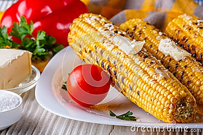 Grilled corn cob on white wooden rustic background Stock Photo