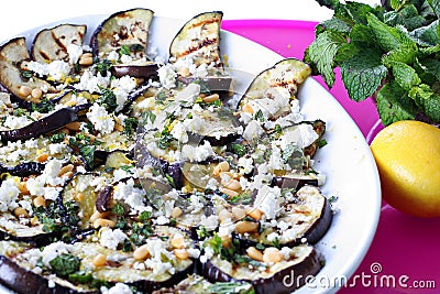 Grilled Eggplant and Goat Cheese with pine nuts Stock Photo