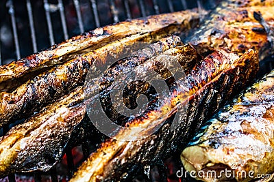 Grilled fish on charcoal grill. Fresh fish barbecue Stock Photo