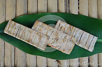 Grilled flat banana Cambodian food on banana leaf Stock Photo