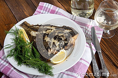 Grilled flounder on the white plate Stock Photo
