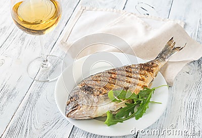 Grilled gilt-head bream on the plate Stock Photo