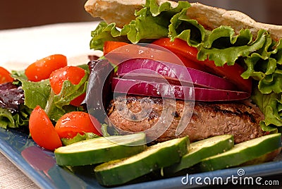 A grilled hamburger in a pita Stock Photo