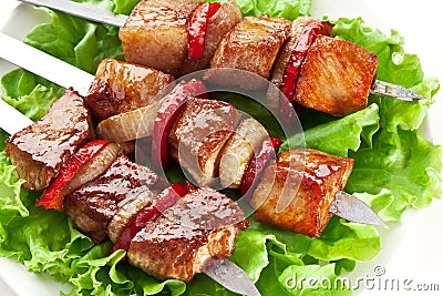 Grilled kebab (shashlik) on spits. Stock Photo