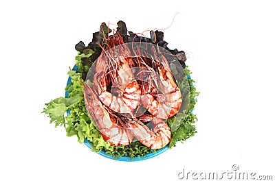 Grilled large fresh prawns served with megetables on blue plate Stock Photo