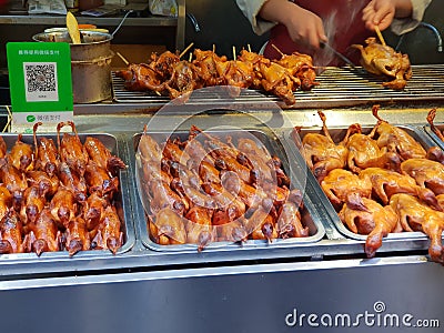 Grilled little ducks at a local Chinese market in Beijing Editorial Stock Photo