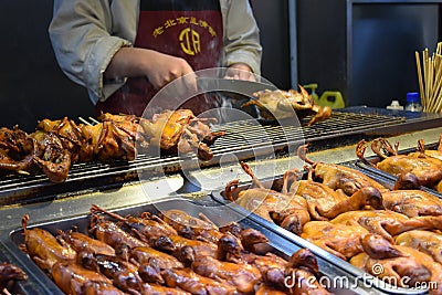 Grilled little ducks at a local Chinese market in Beijing Editorial Stock Photo