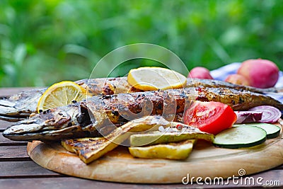 Grilled mackerel fish on the wooden tray Stock Photo