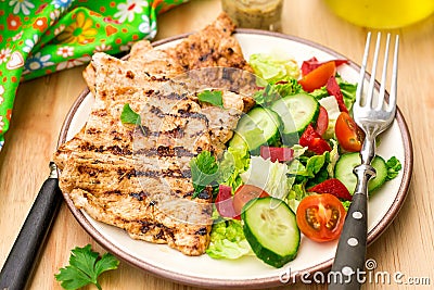 Grilled marinated turkey with fresh vegetables Stock Photo