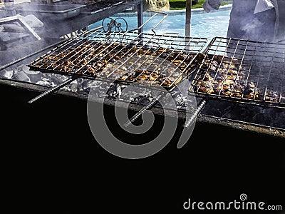 Grilled meat roasted skewers barbecue. Barbeque churrasco meat background. Appetizing meat roasted BBQ grill outdoor Stock Photo