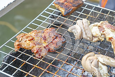 Grilled meat scorched on the grill, burnt Stock Photo
