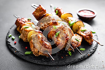 Grilled meat skewers, shish kebab on black background Stock Photo