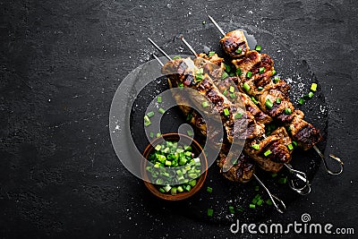 Grilled meat skewers, shish kebab on black background, top view Stock Photo