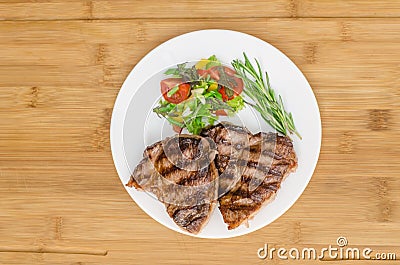 Grilled meat at white plate Stock Photo