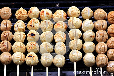 Grilled meatballs on bamboo sticks Stock Photo