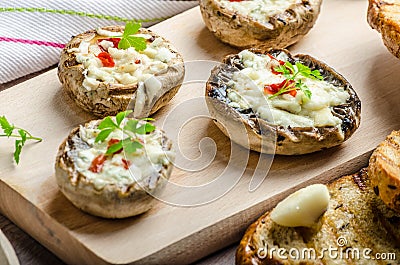 Grilled mushrooms stuffed cheese and chilli Stock Photo