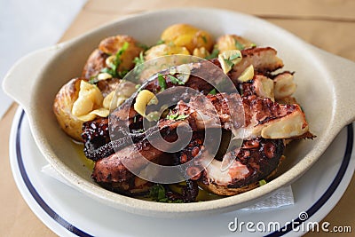 Grilled octopus with batatas a murro Stock Photo
