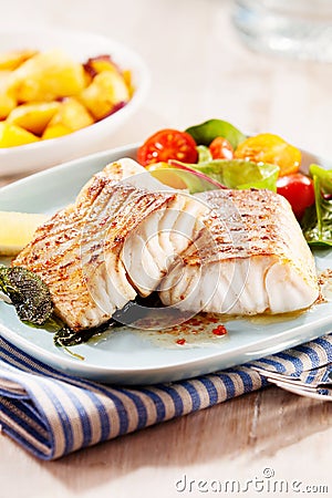Grilled or oven-baked pollock fillets Stock Photo