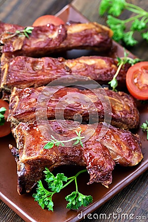 Grilled pork ribs on ceramic plate Stock Photo