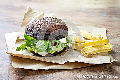 Grilled portobello bun mushroom burger. Vegan, gluten free, grain free, healthy veggies hamburger with guacamole, fresh vegetables Stock Photo