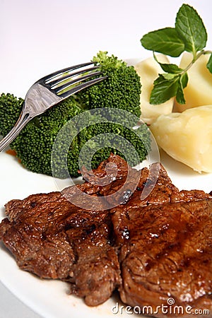 Grilled ribeye beef steak broccoli potato Stock Photo