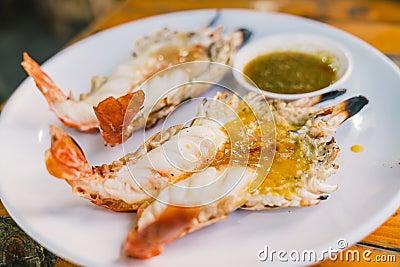 Grilled river prawns or shrimps served with Thai spicy seafood sauce, Thailand famous delicious menu. Stock Photo