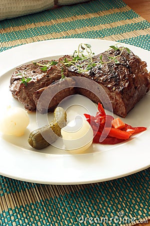 Grilled rump steak with vegetable on a plate Stock Photo