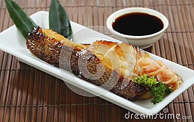 Grilled Saba fish with sauce isolated Stock Photo