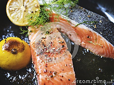 Grilled salmon fillet sprinkled with salt and pepper Stock Photo