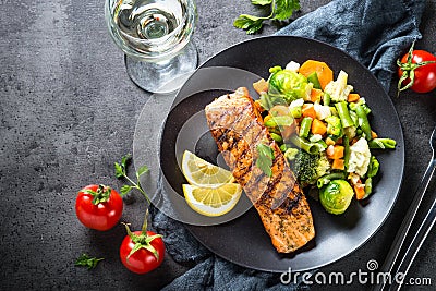 Grilled salmon fillet with vegetables mix. Stock Photo